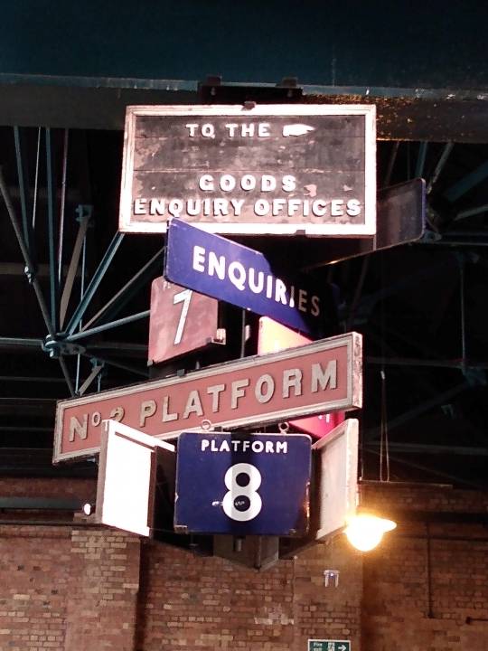 A hanging display of old train station signs at the National Railway Museum